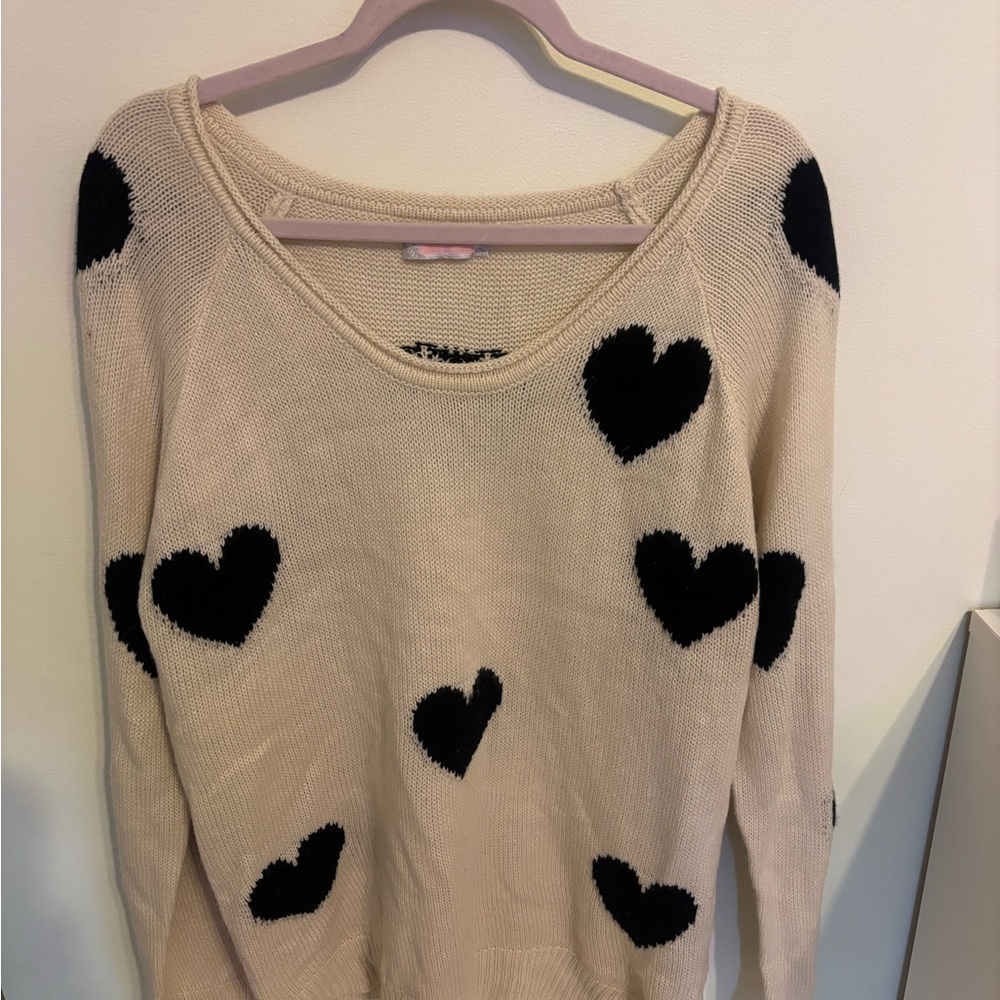 Chic Cream Sweater with Black Heart Accents